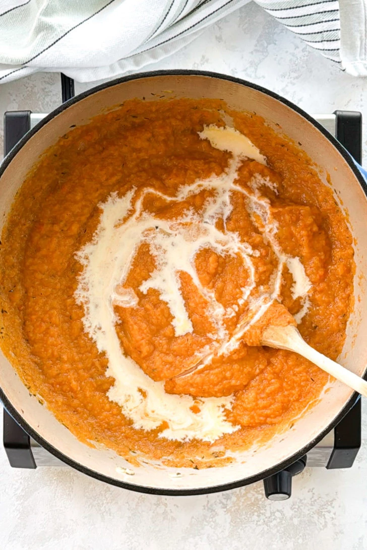 Pureed rutabaga and cream in a pan.