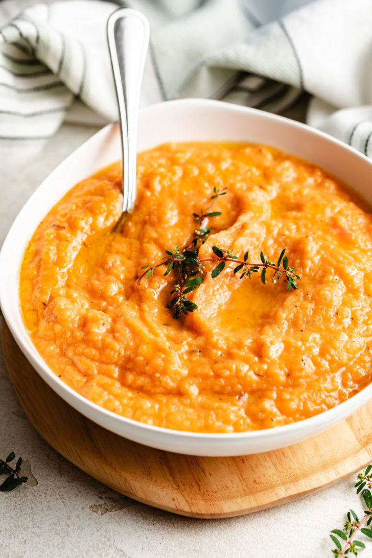Roasted rutabaga soup in a white dish.
