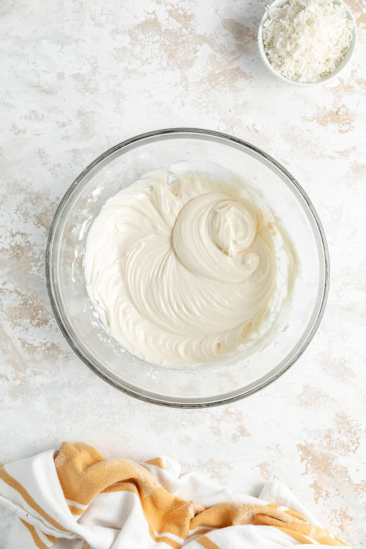 Cream cheese frosting in a bowl.