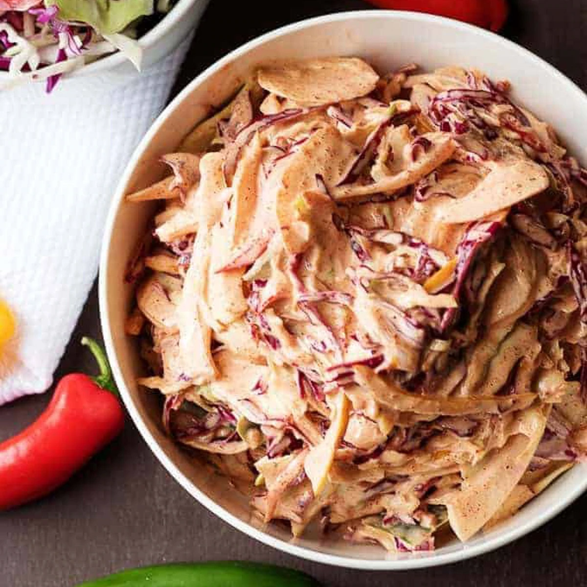 Overhead view of spicy coleslaw in a bowl.