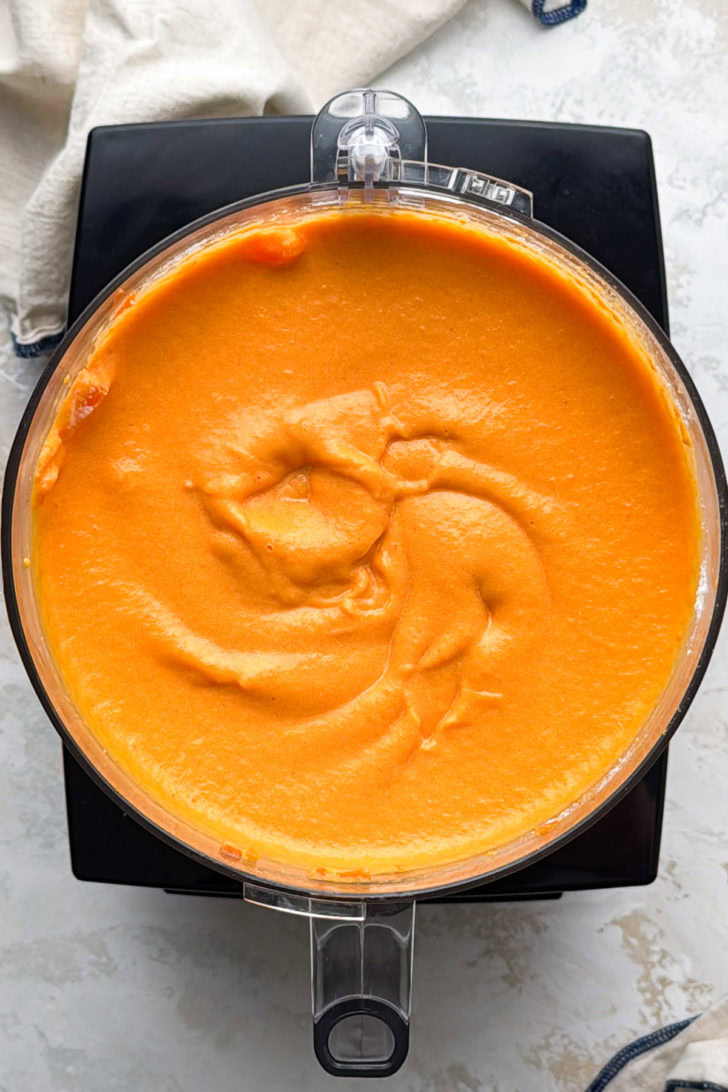 The carrot mixture is blended smooth in a food processor.