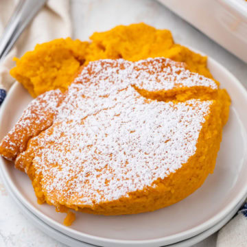 Scoop of carrot souffle on a plate.