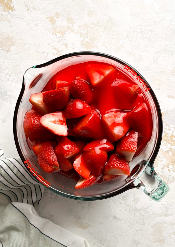 Halved strawberries tossed with Jello.