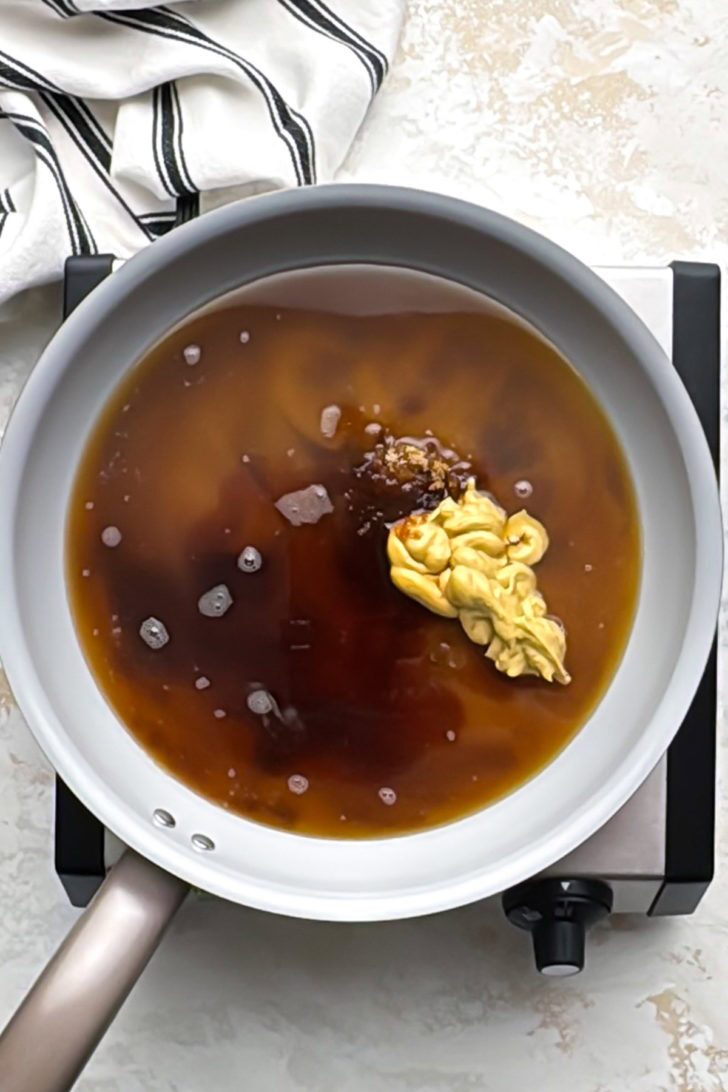 Ham glaze ingredients in a small saucepan before cooking.