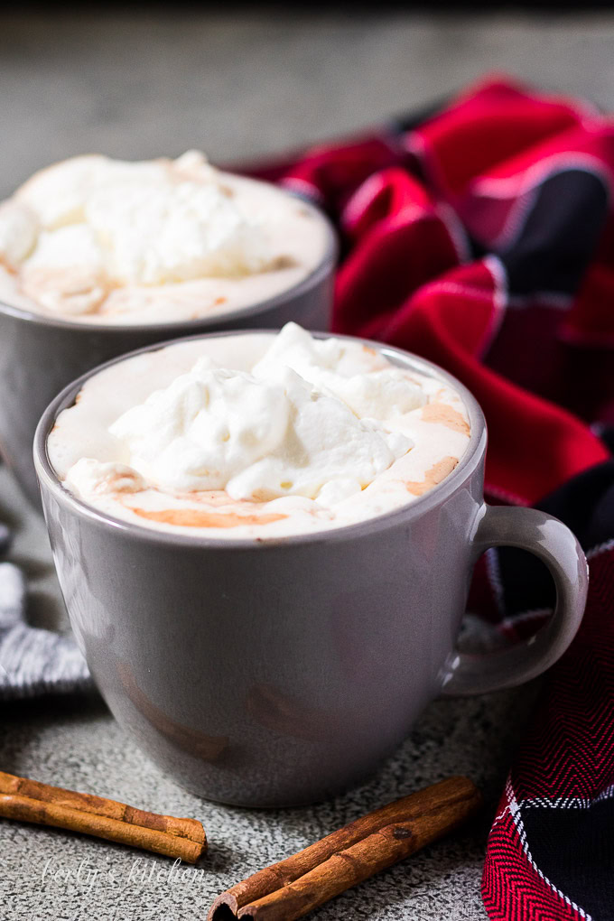 Two mugs of instant pot gingerbread hot chocolate in mugs.
