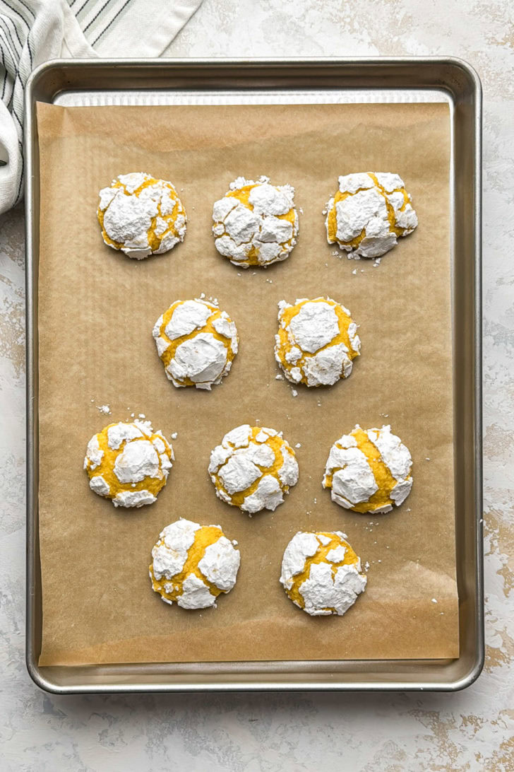 Close-up of lemon crinkle cookies with crackled tops.