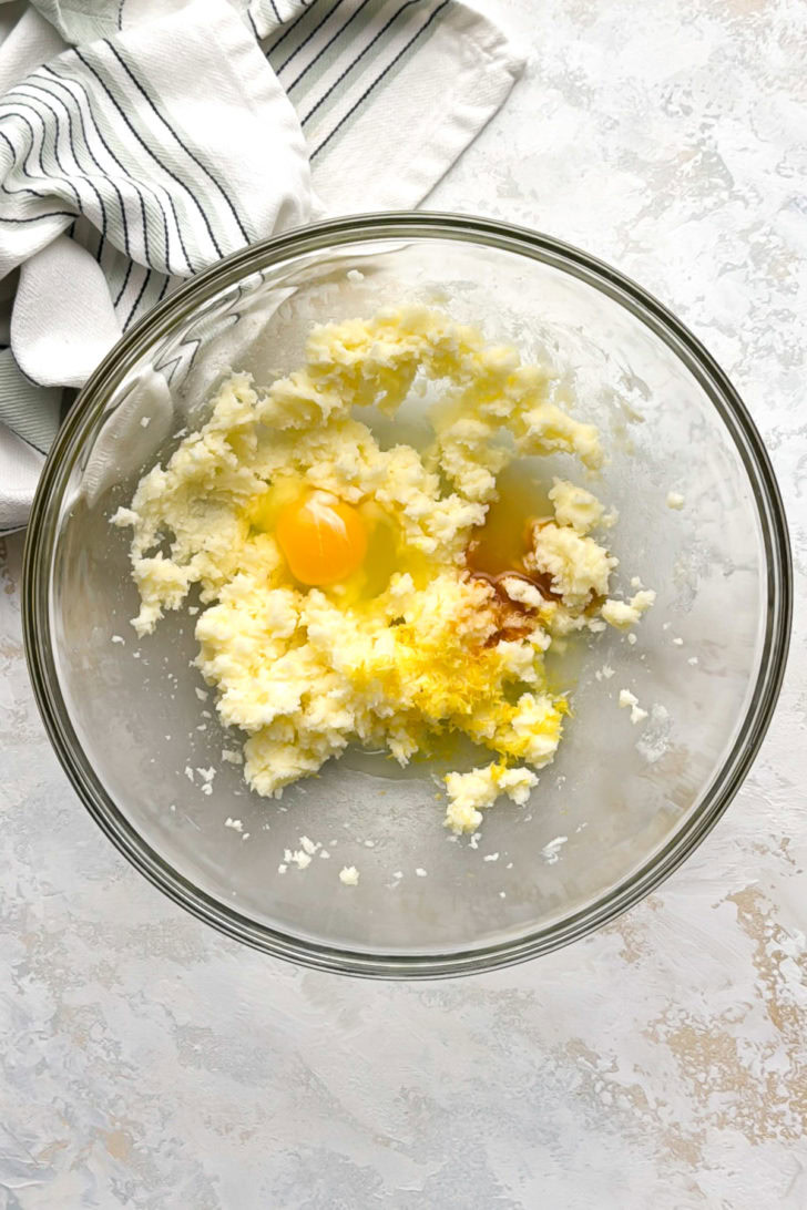 Egg, vanilla, and lemon zest added to the butter mixture.