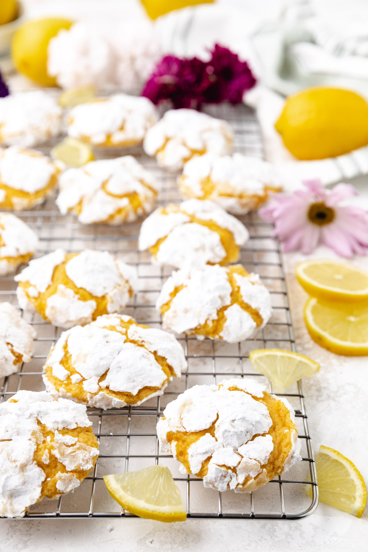 Soft lemon cookies cooling on a wire rack.