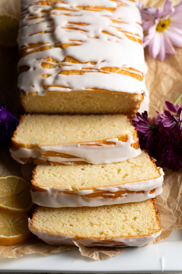 Lemon quick bread slices on parchment paper.