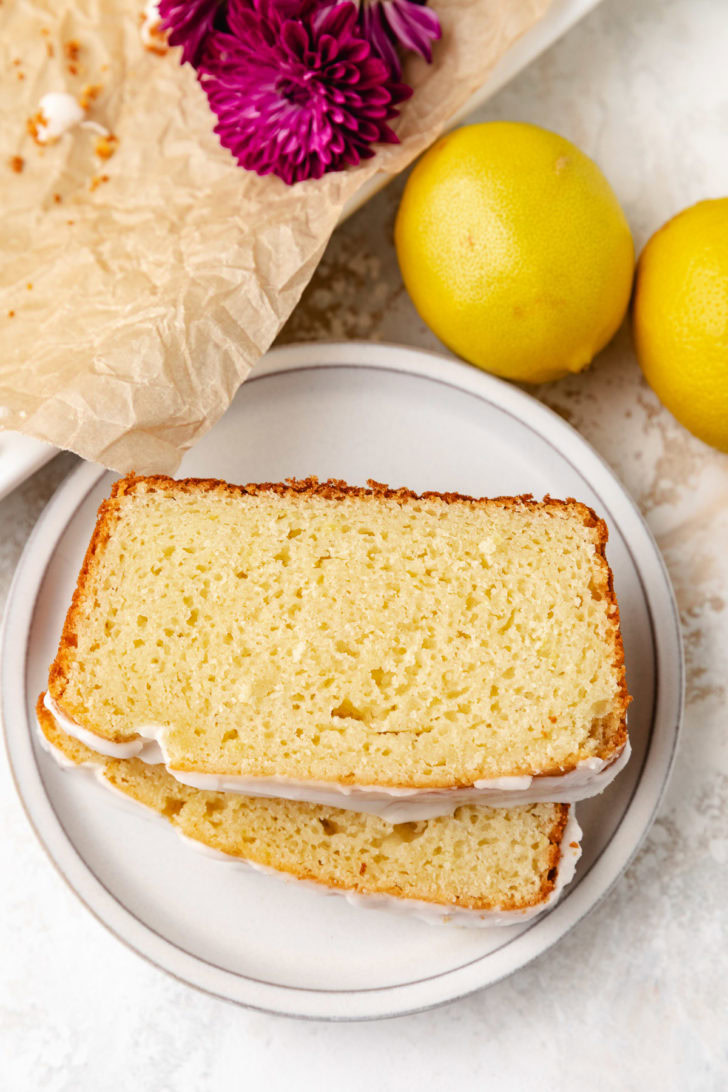 Lemon bread slices with glaze on a plate.