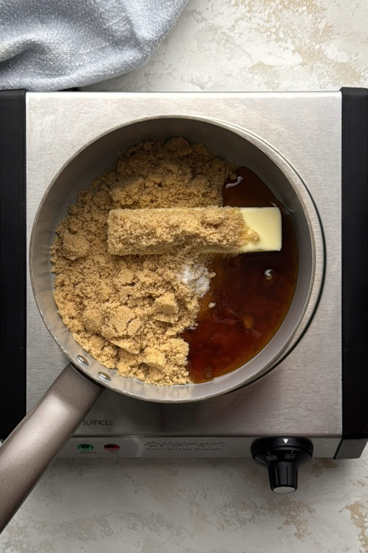 Butter, brown sugar, dark corn syrup, and salt in a saucepan before making the sticky bun caramel topping.