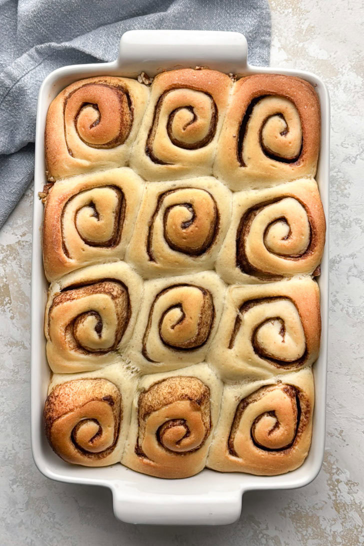 Baked sticky buns in the pan before being flipped out onto a serving tray.