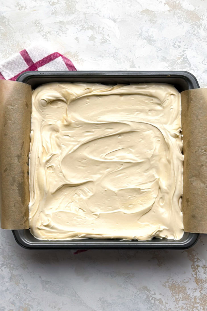 Caramel cheesecake filling spread over the cooled shortbread crust.