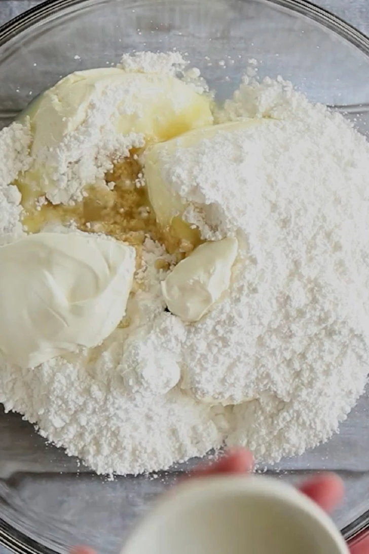 Close up view of the ingredients for key lime dip in a bowl.