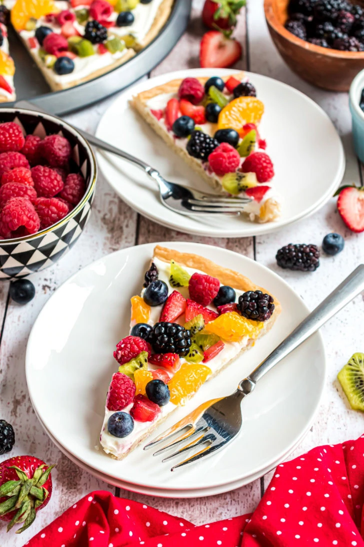 Plated dessert slice with fresh fruit.