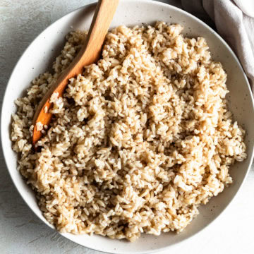 Instant Pot brown rice served in a white bowl.