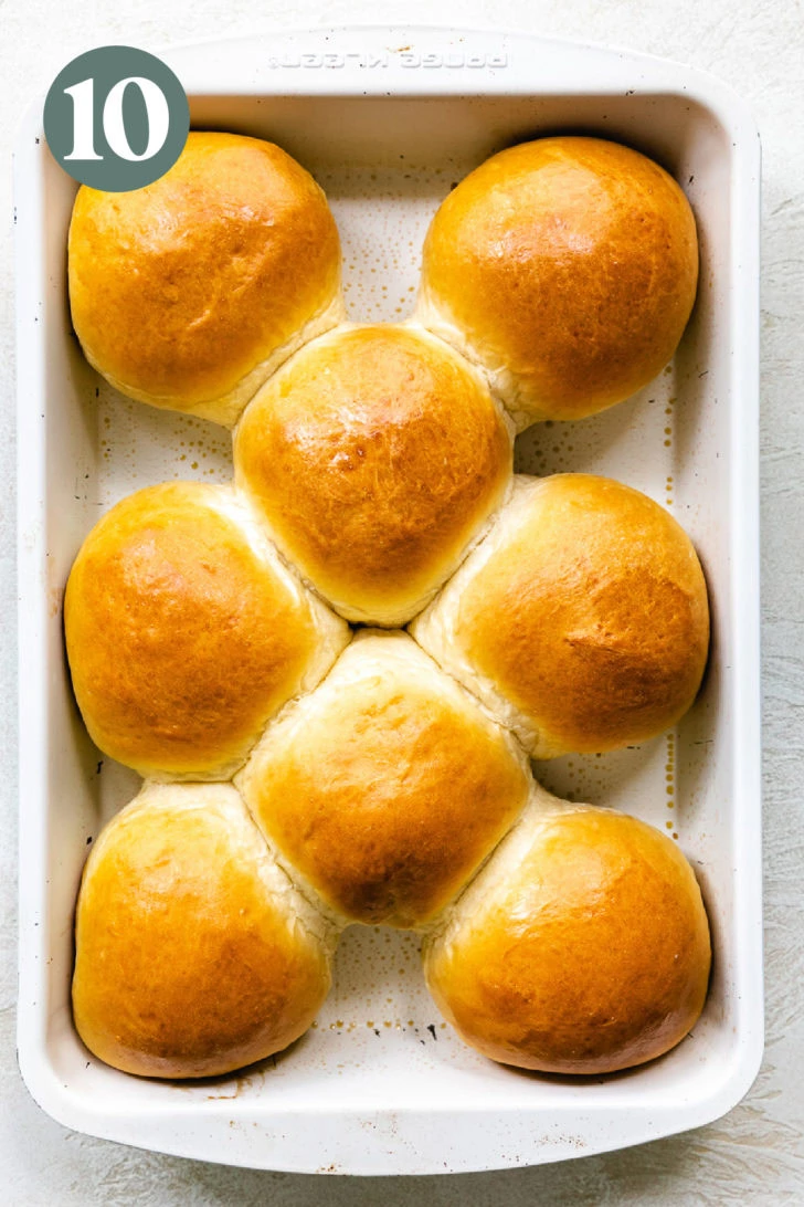 Baked brioche rolls in a baking dish.
