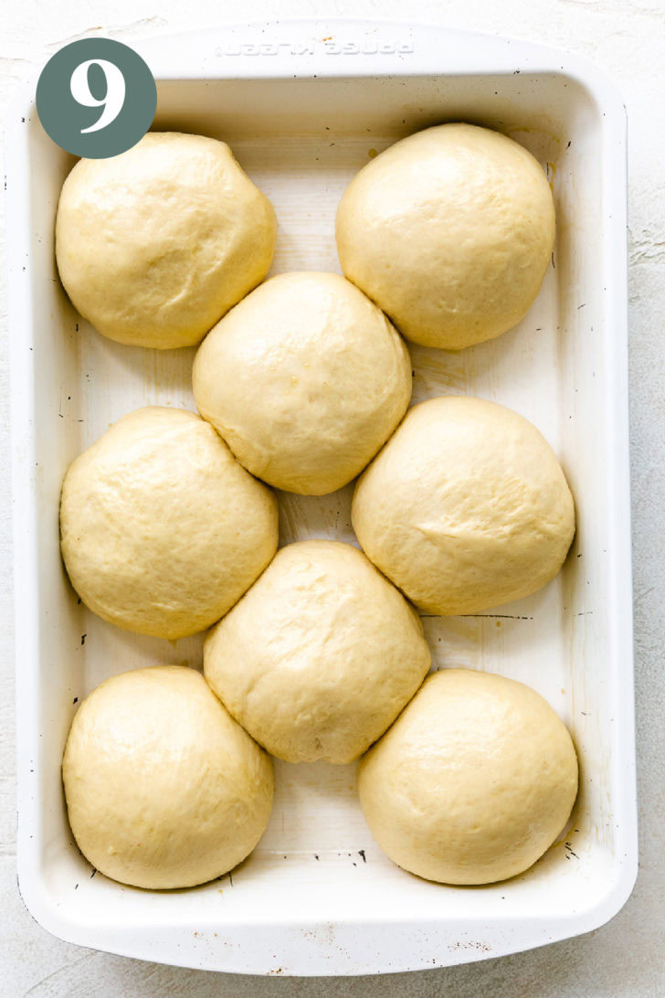 Pan of unbaked, risen brioche dough in a pan.