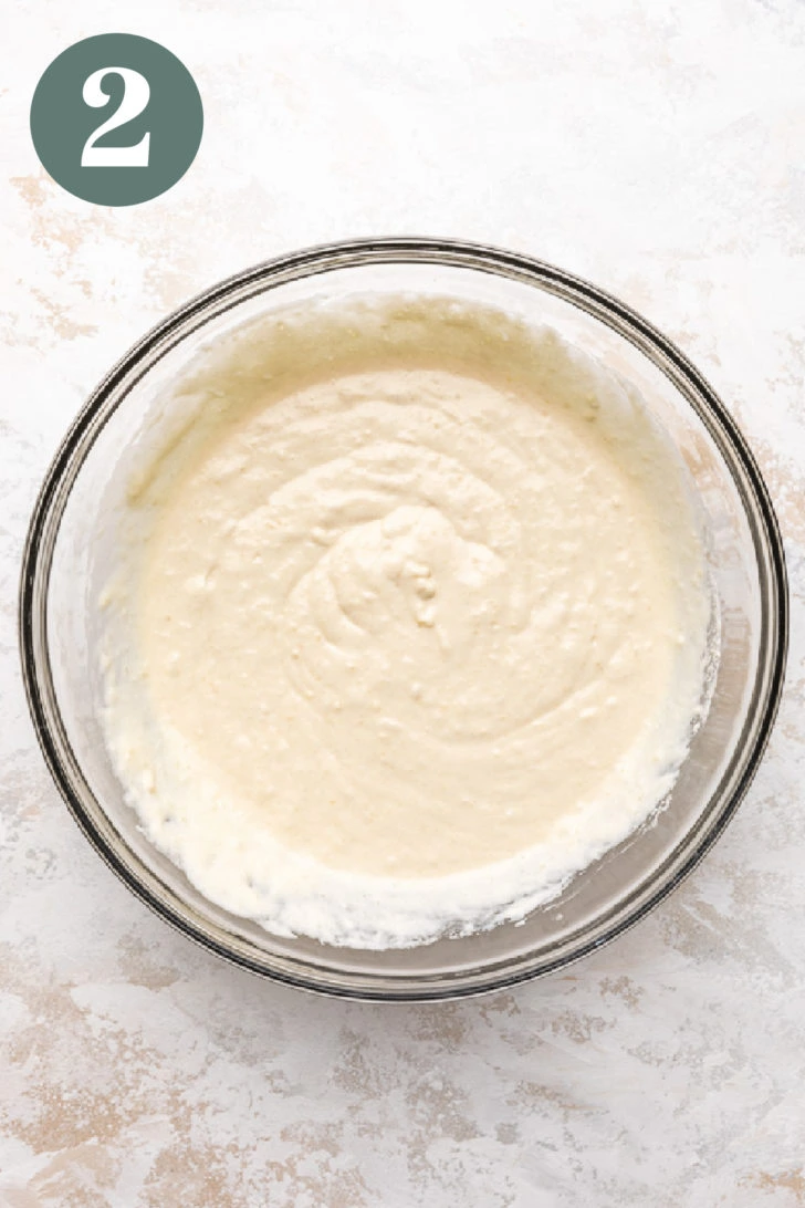 Buttermilk pancake batter in a glass mixing bowl.