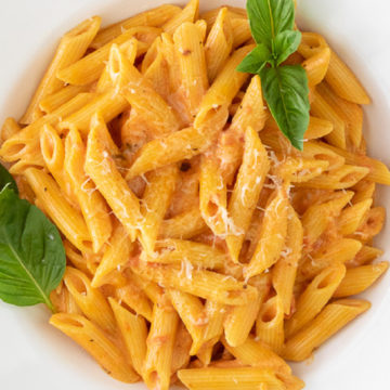 Close up view of a plate of creamy tomato pasta made in the Instant Pot.