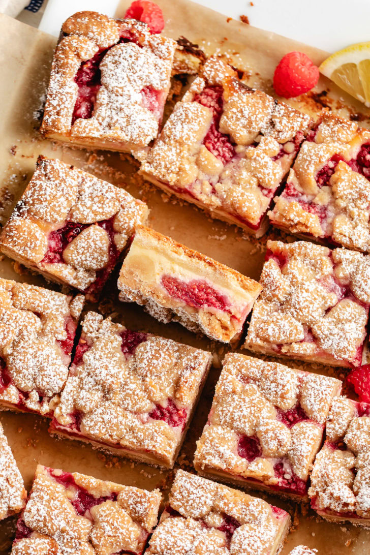 Overhead view of a batch of lemon raspberry bars with crumb topping.