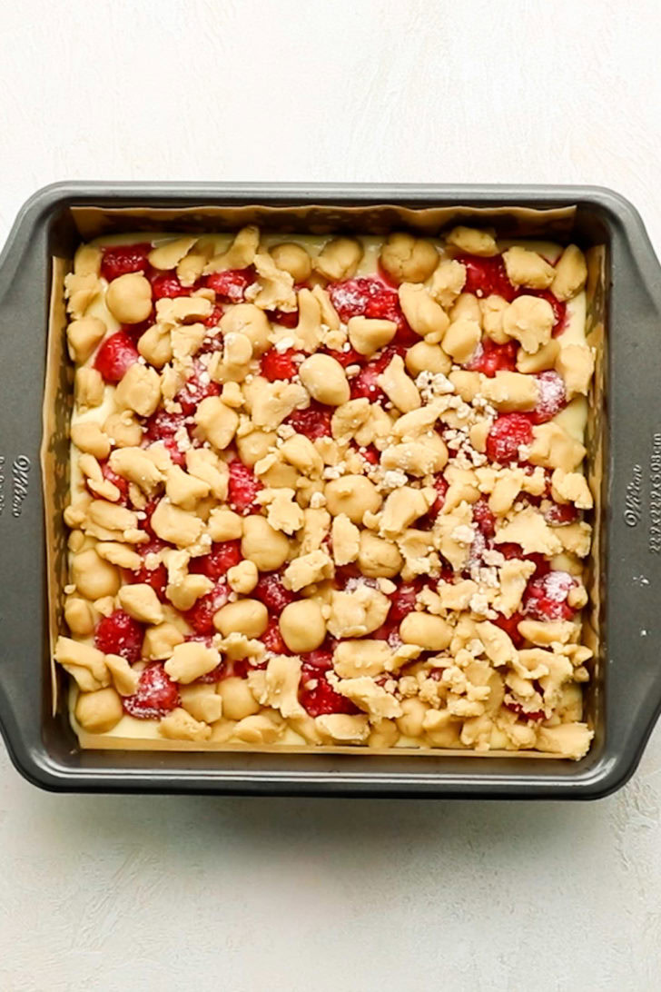 Brown sugar crumb topping placed over lemon raspberries bars before baking.