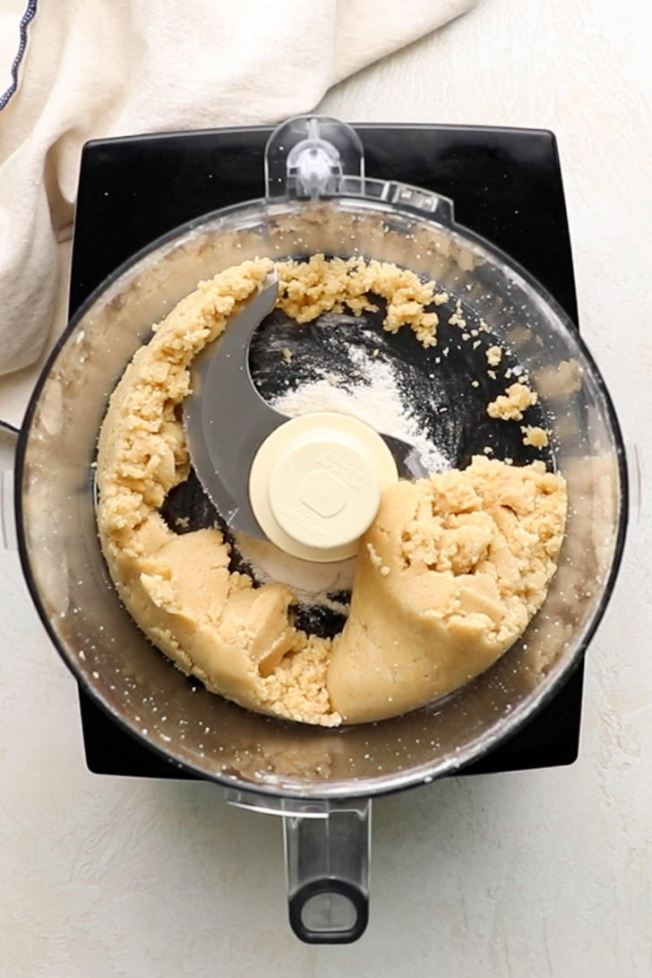 Top down view of crumb topping being made in a food processor.