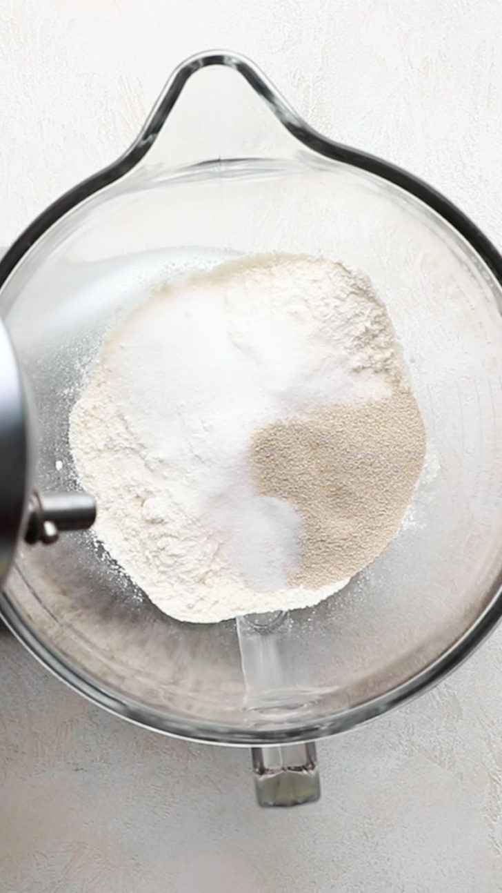 Flour, sugar, and yeast in mixer bowl.