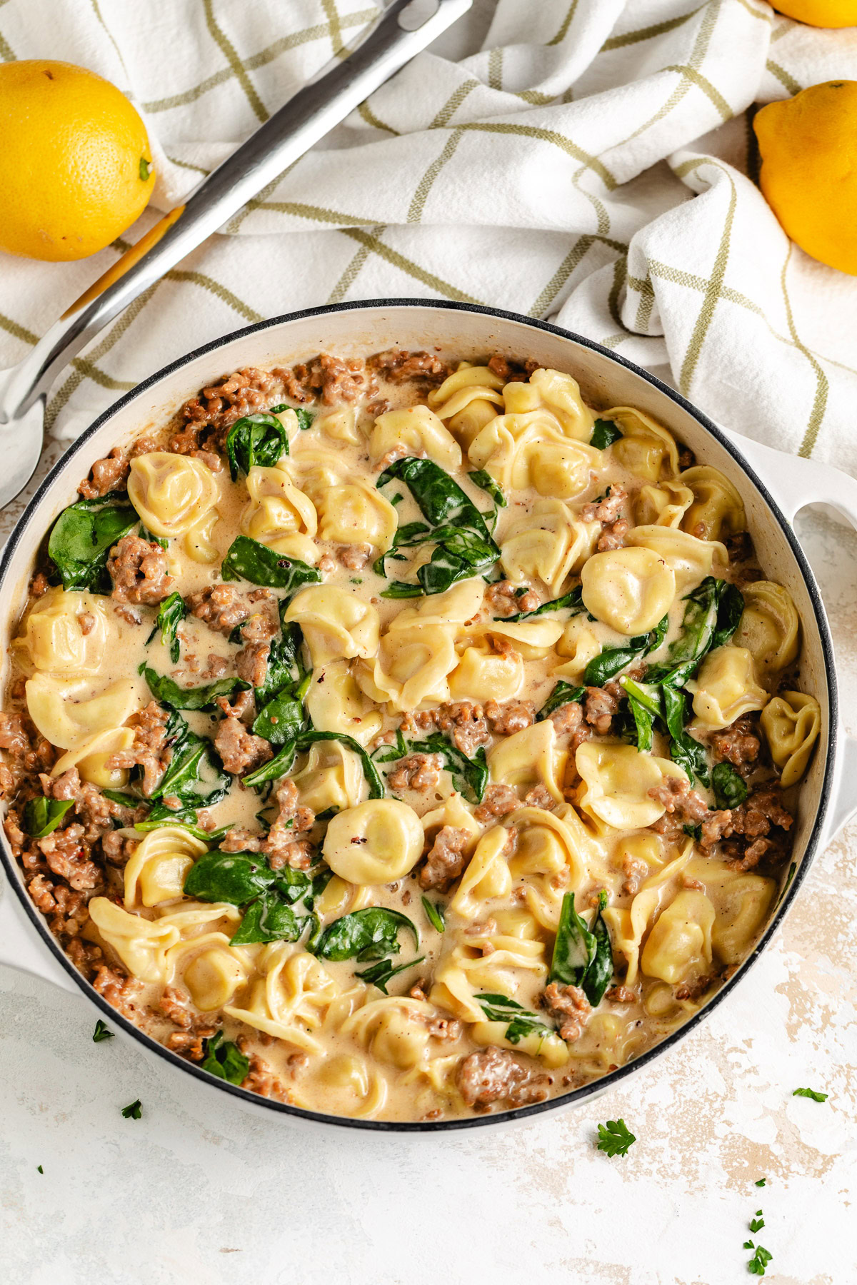 Cheese tortellini with Italian sausage and spinach.