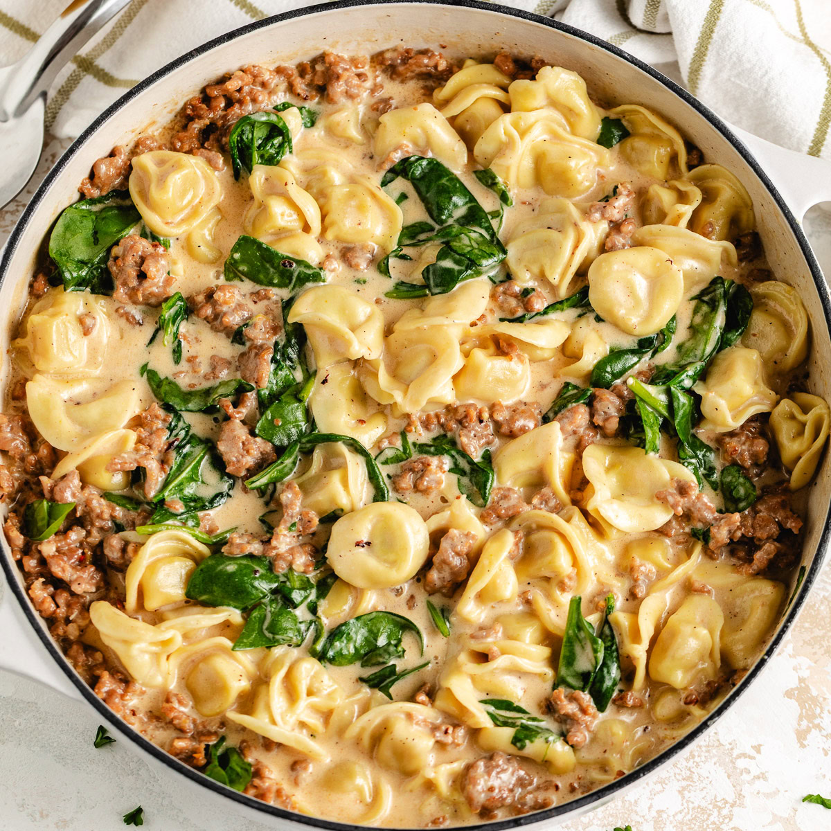 Creamy tortellini with Italian sausage and spinach.