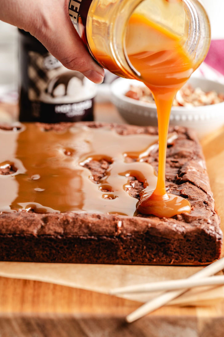 Caramel sauce poured over warm chocolate brownies.