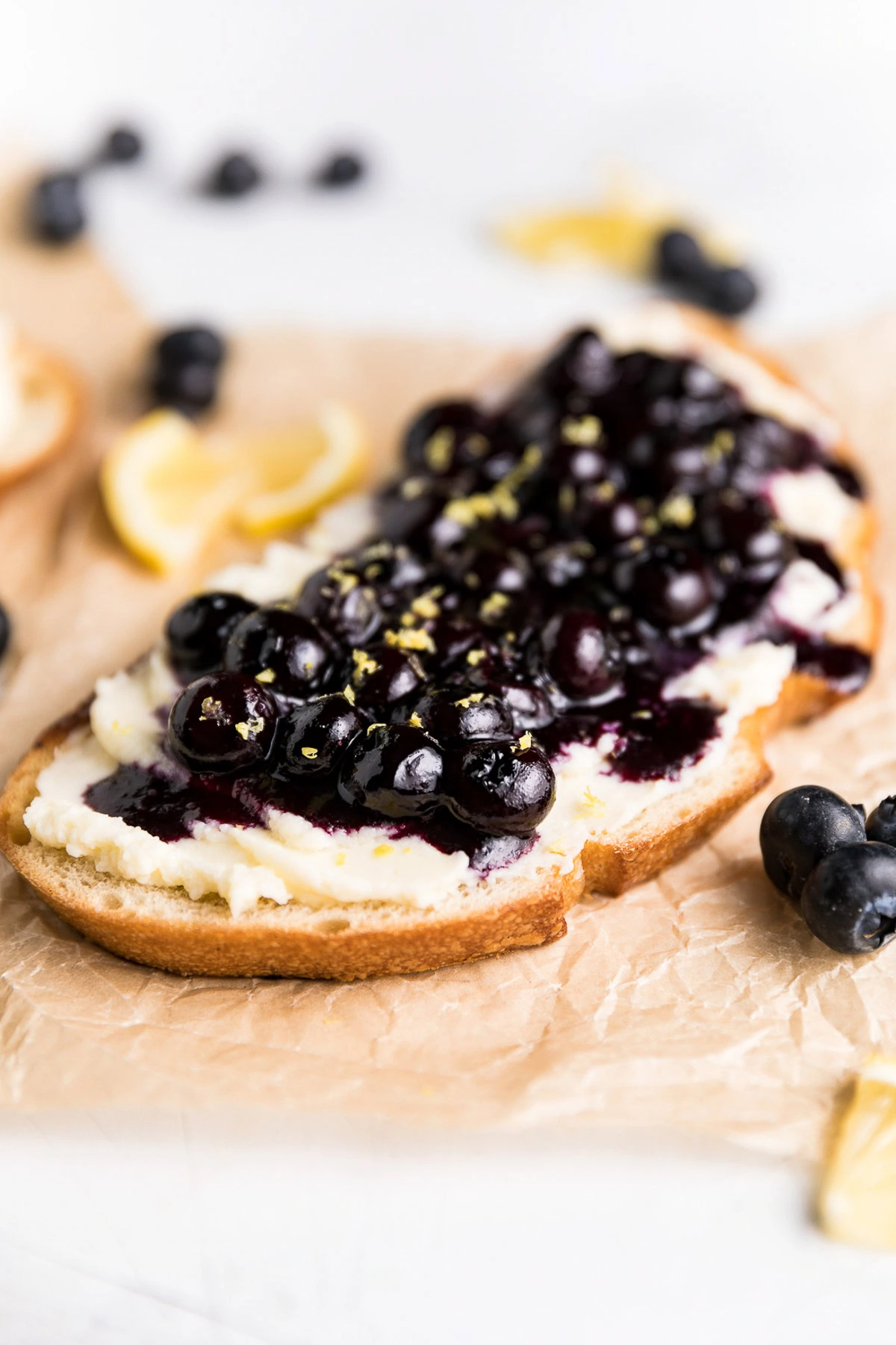 Blueberry toast with lemon zest and fresh blueberries.