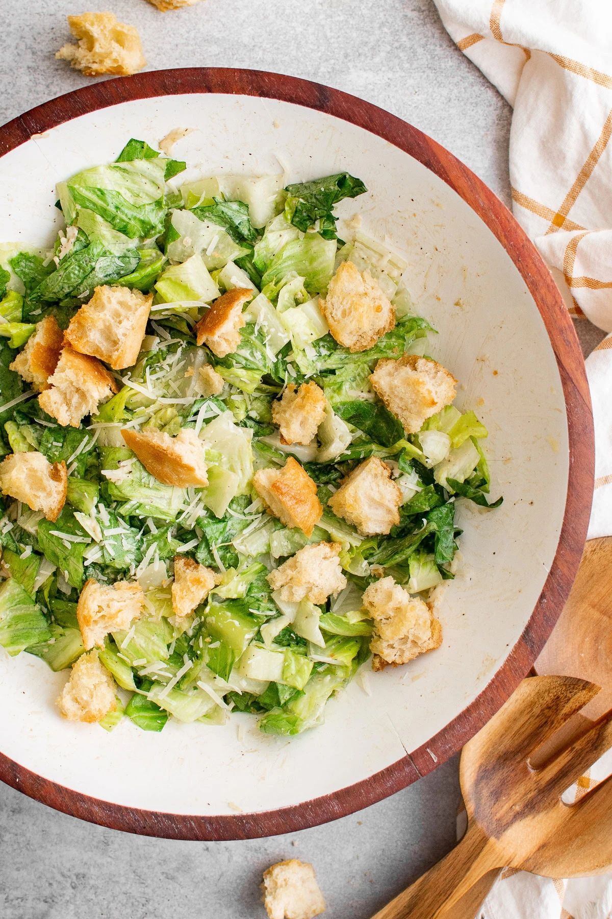 Caesar salad with croutons and Parmesan in a serving bowl.