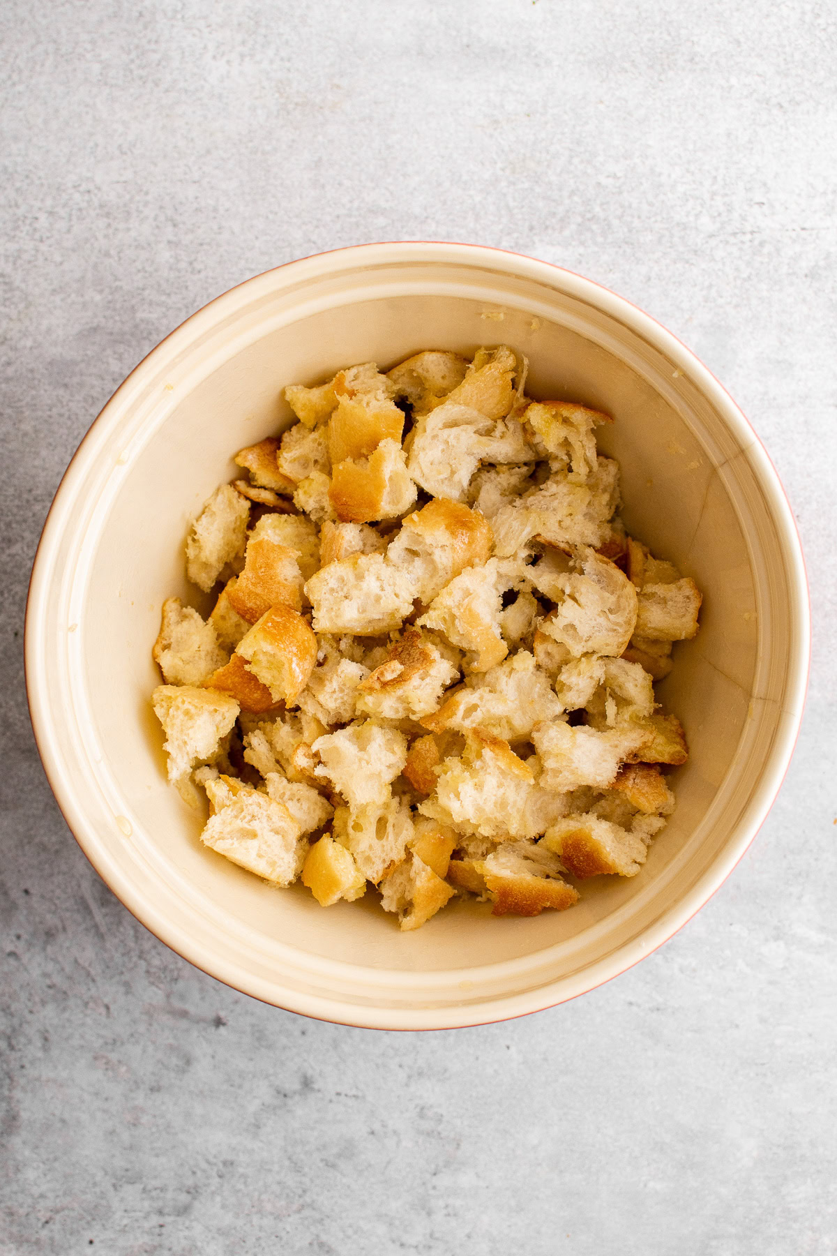 Bread cubes in a mixing bowl.