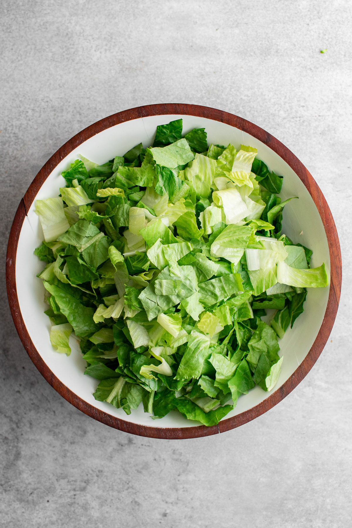 Chopped romaine lettuce in a large bowl.