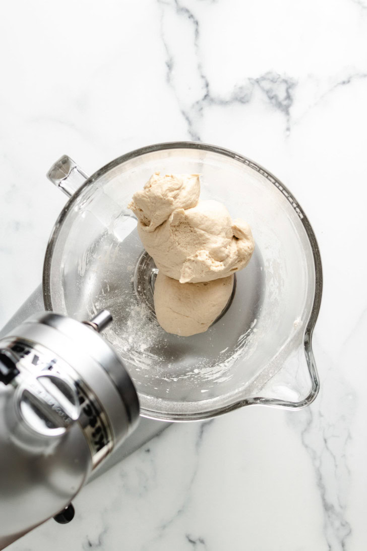French bread dough mixed in a stand mixer bowl.