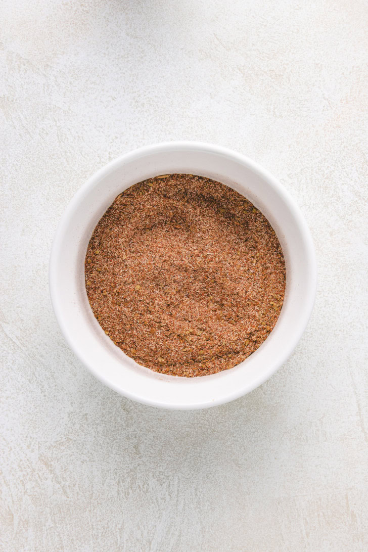 Overhead view of spices mixed together in a dish.