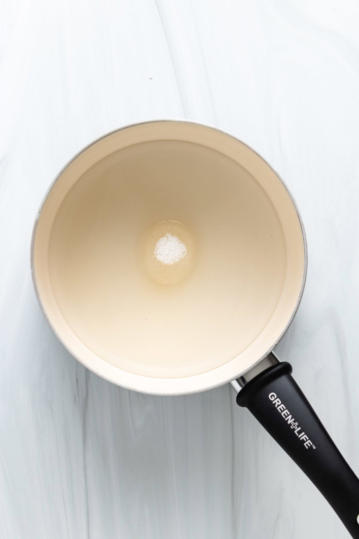 Sugar and water in a saucepan.