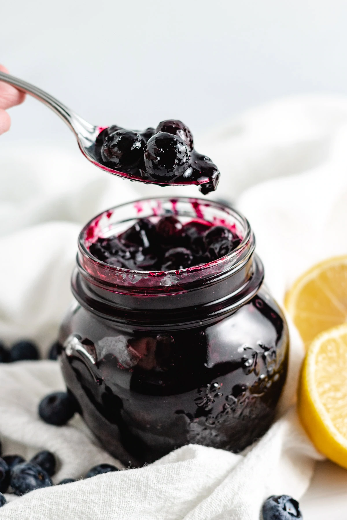 Blueberry compote on a spoon.