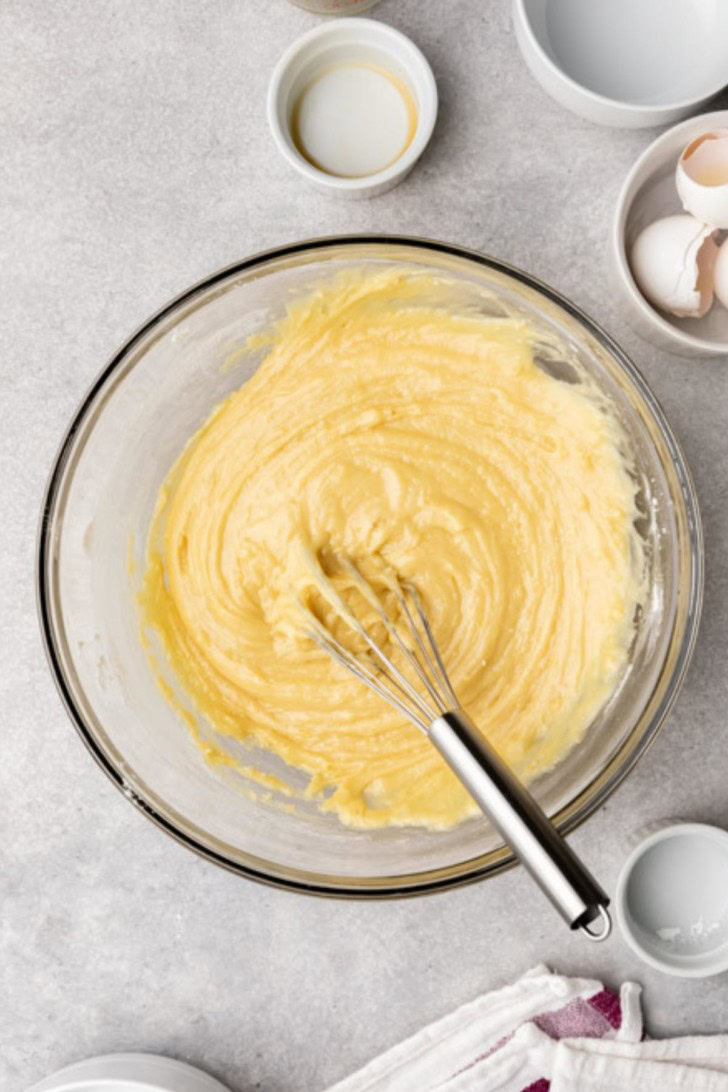 Flour, baking powder, and salt mixed with eggs, butter, and sugar.