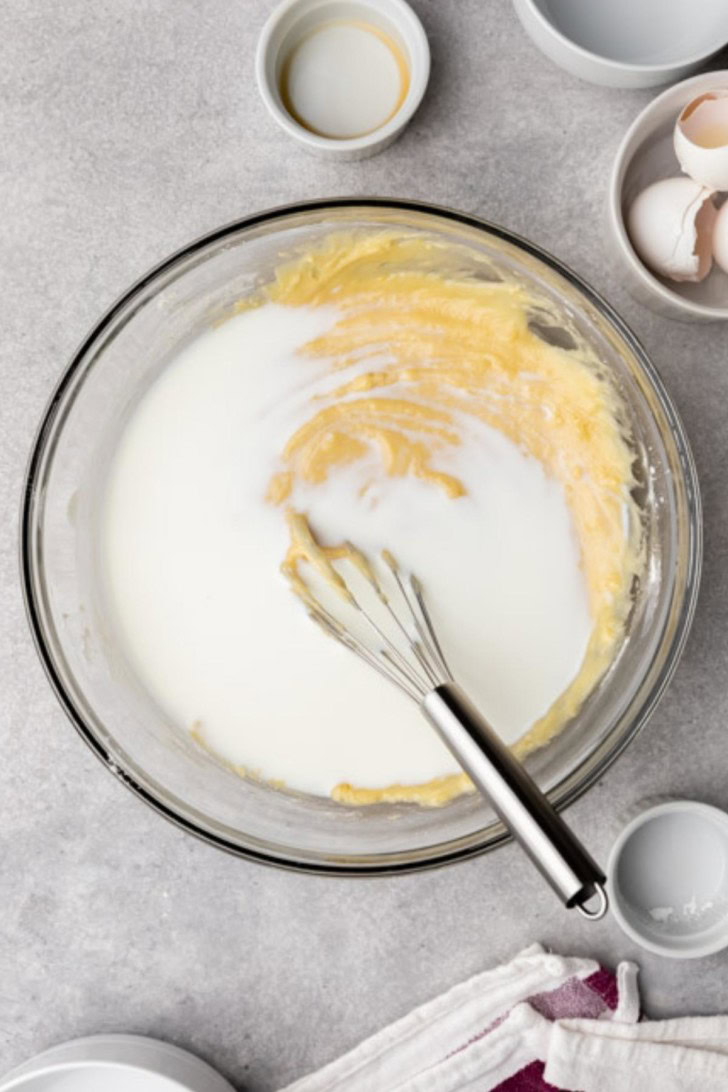 Milk poured over cake batter.