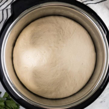 Overhead view of dough proofing in the Instant Pot.