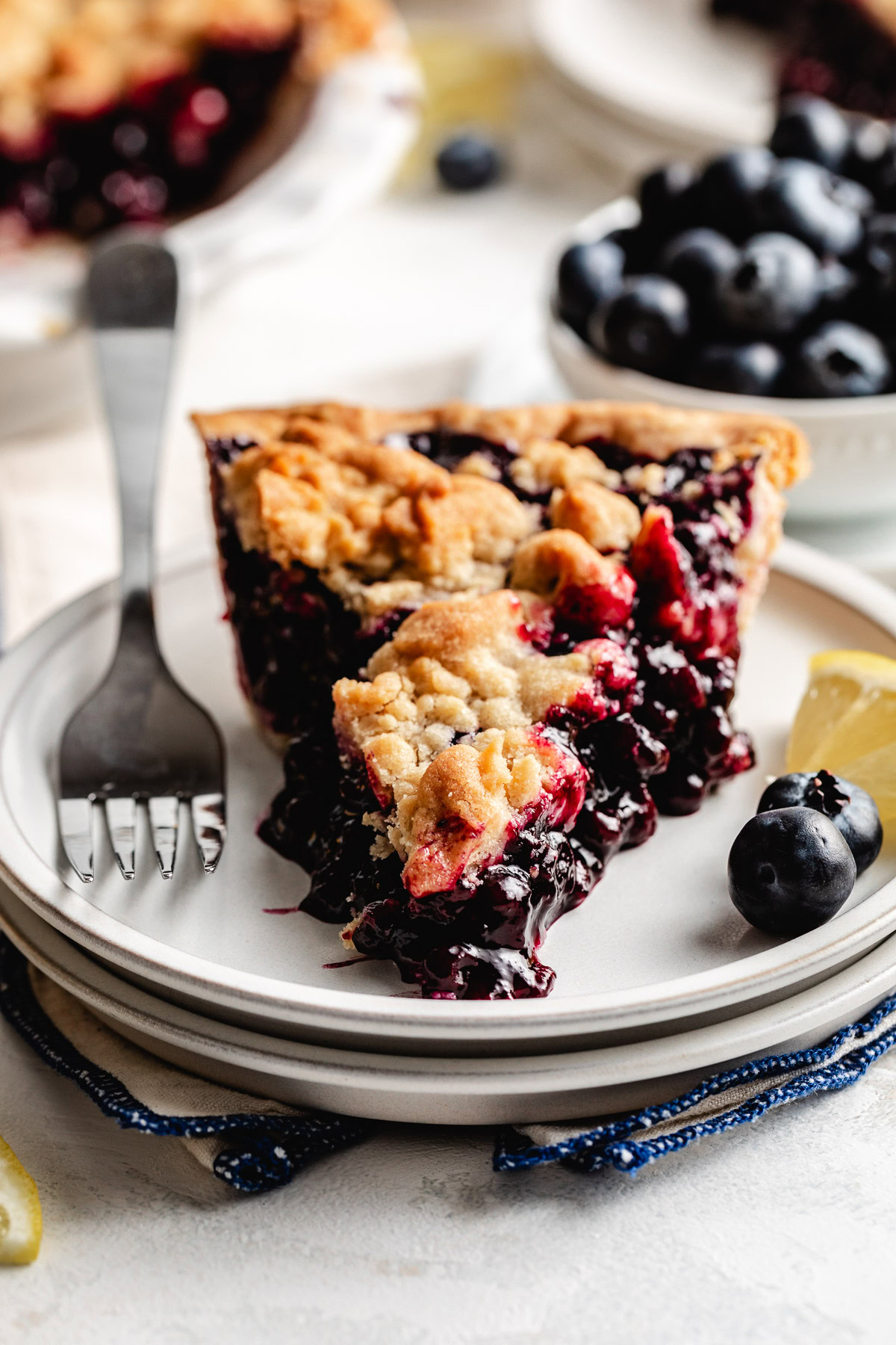 Close up of blueberry pie filling and crumb topping.