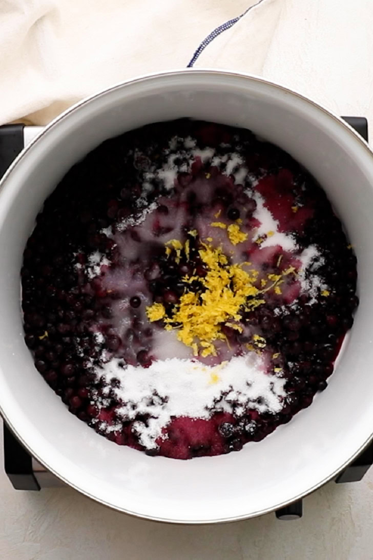 Blueberry pie filling with lemon zest and sugar.