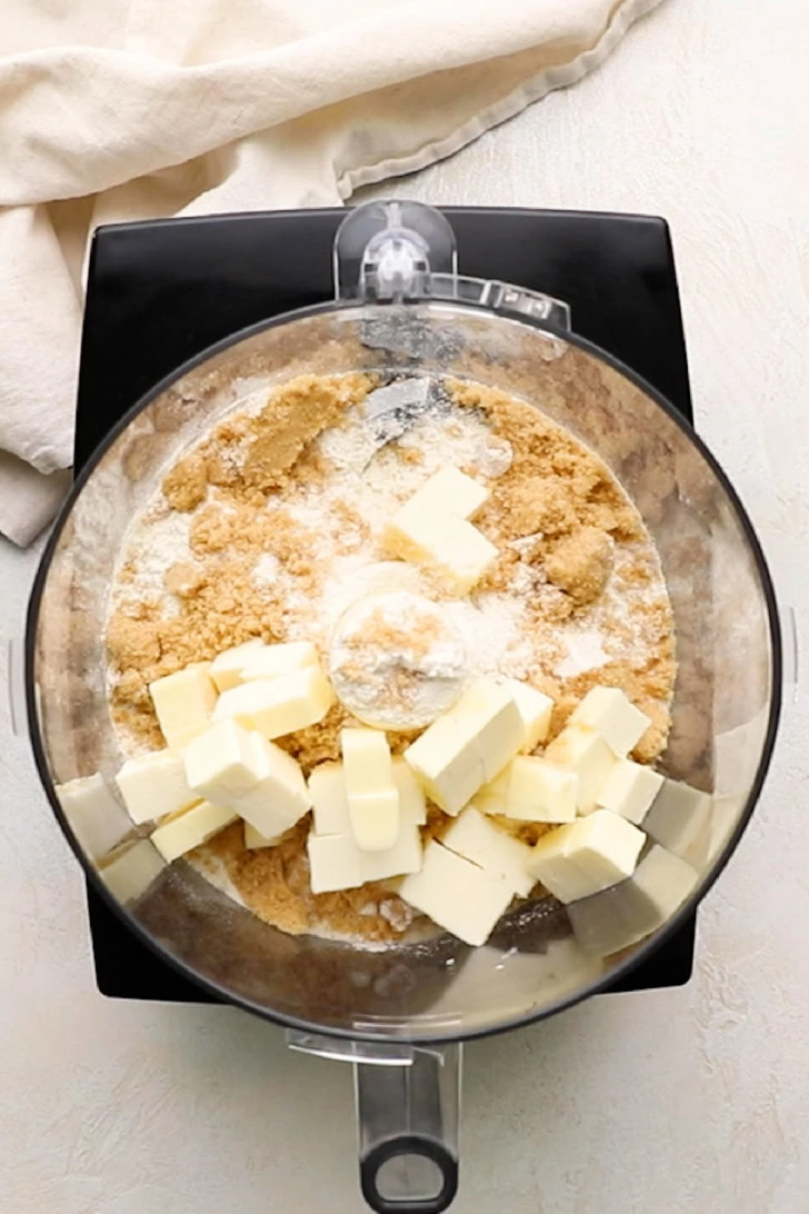 Butter and brown sugar added to flour.