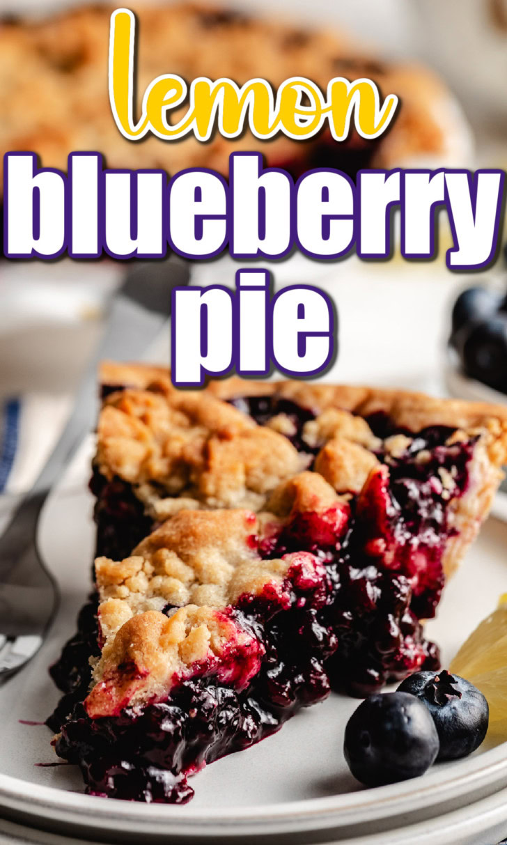 Close up view of a slice of lemon blueberry pie on a stack of plates.
