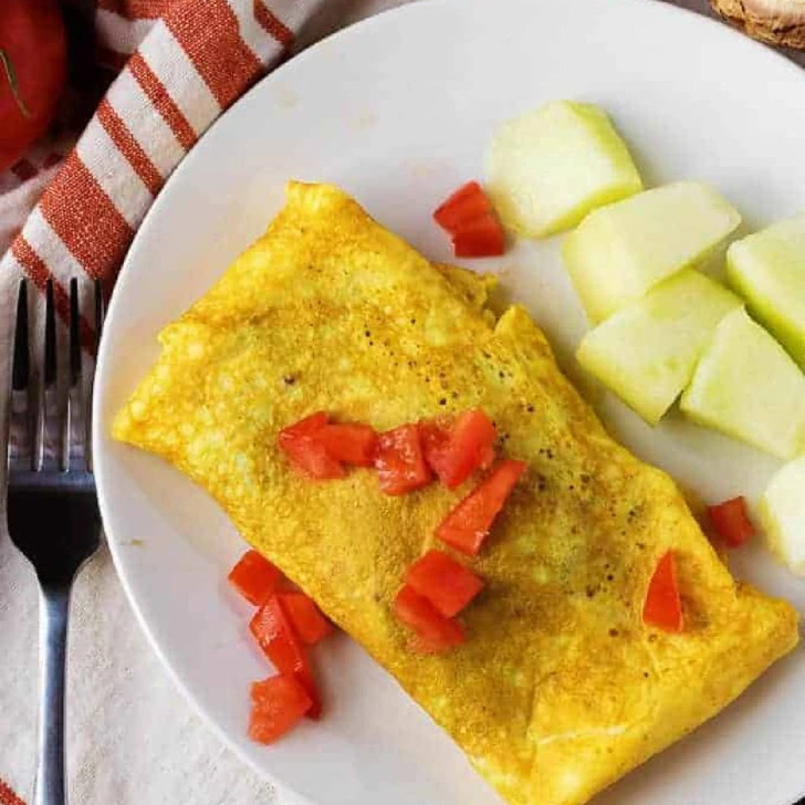 Veggie and mushroom omelette with fresh diced tomatoes.