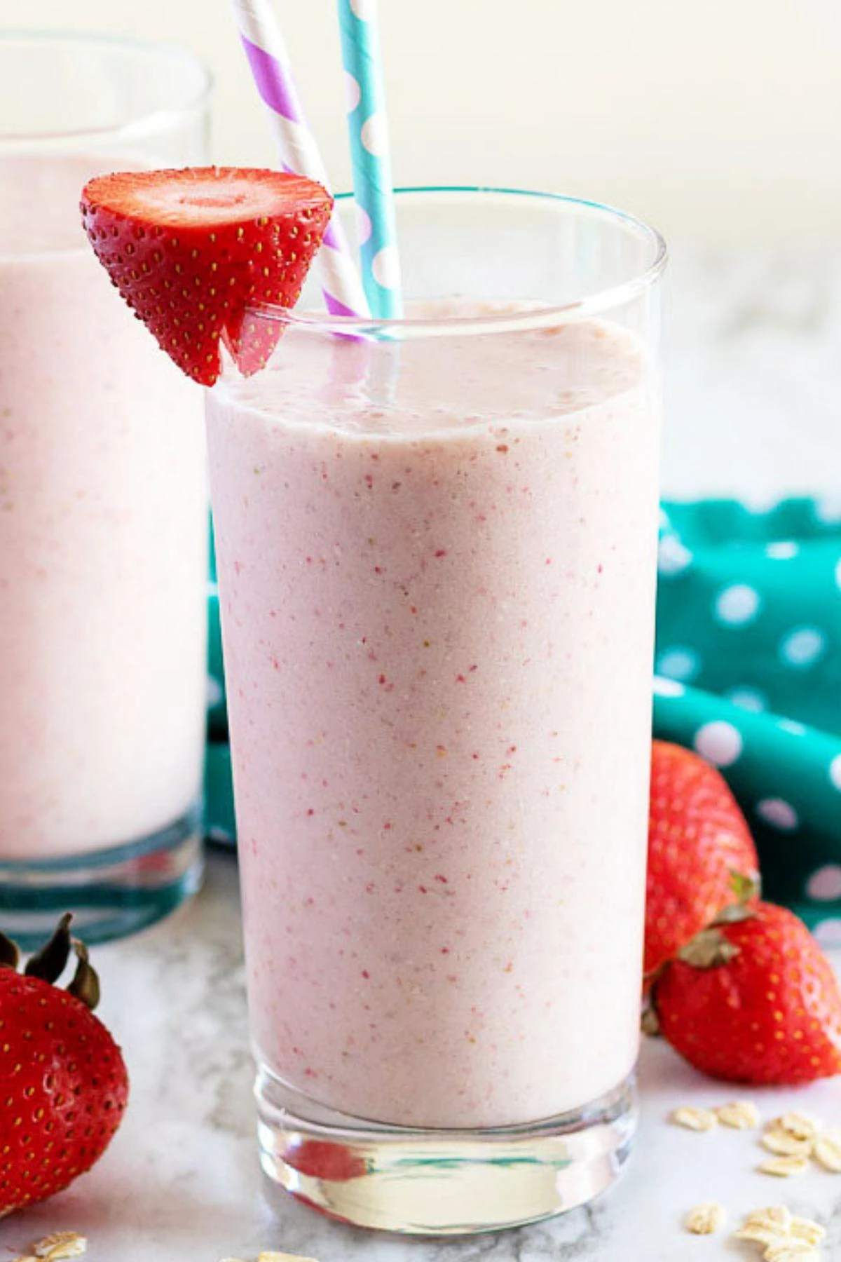 Tall glass filled with strawberry banana breakfast smoothie.