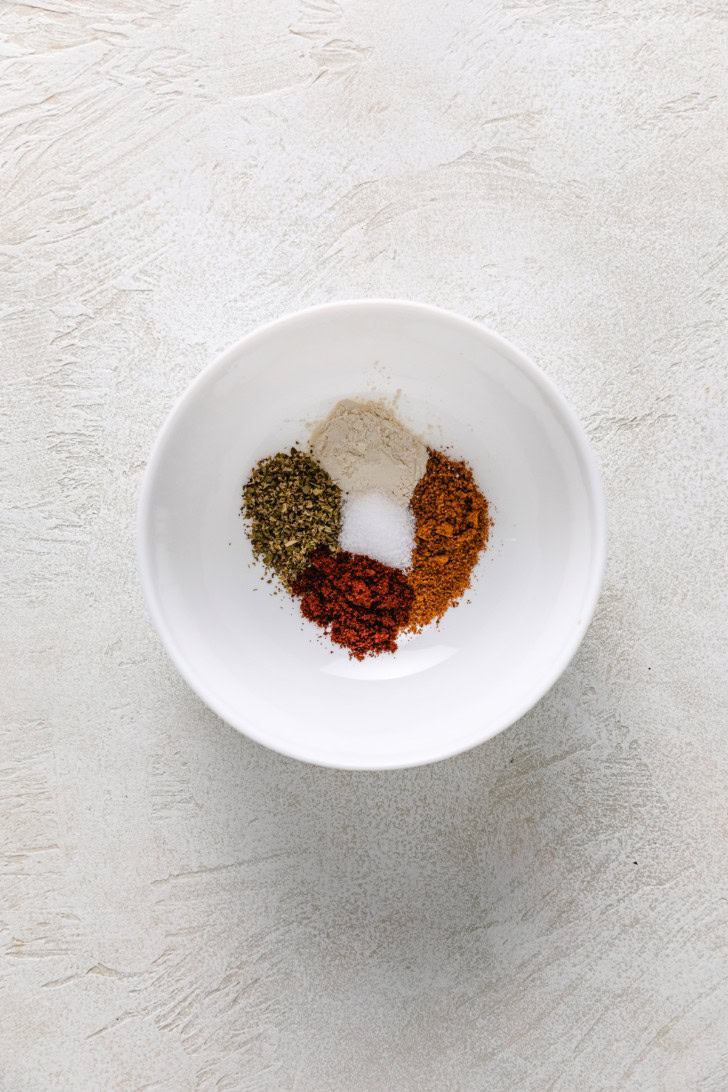 Seasonings for air fryer mahi mahi in a small white bowl.