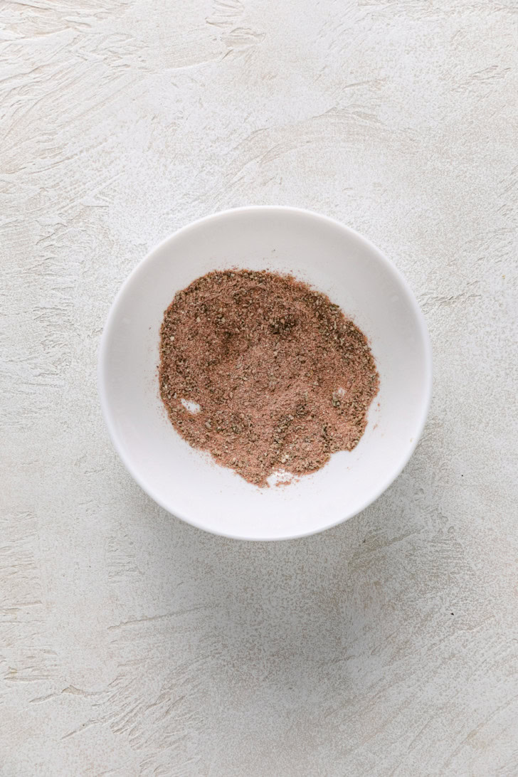 Mixed mahi mahi seasoning in a white bowl.